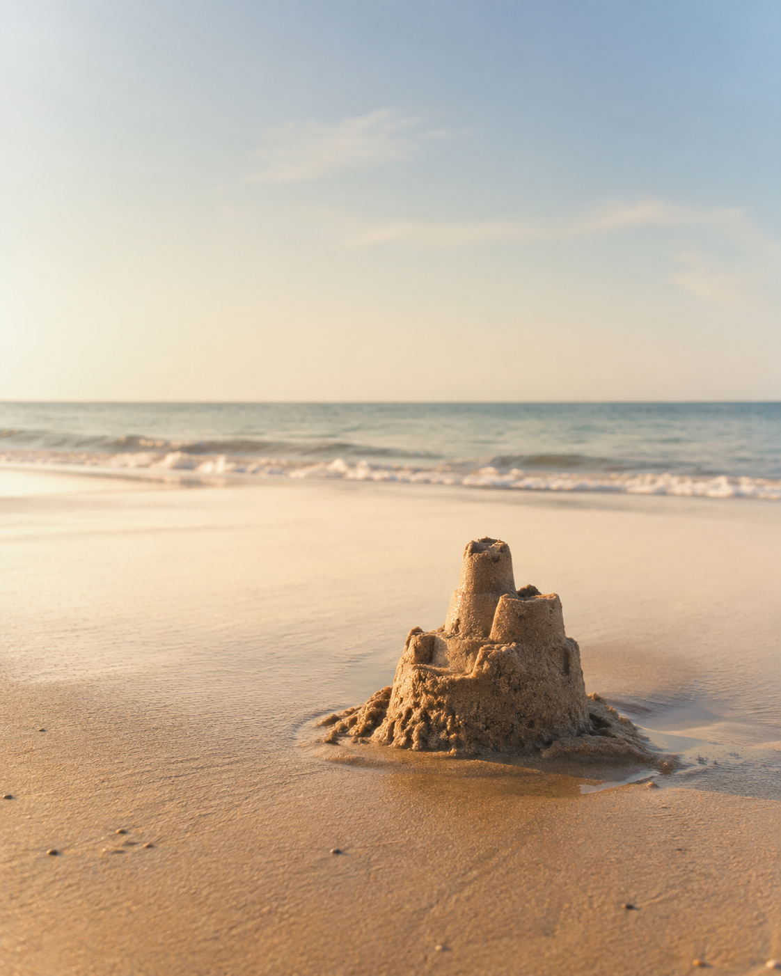 A small sand castle by the sea